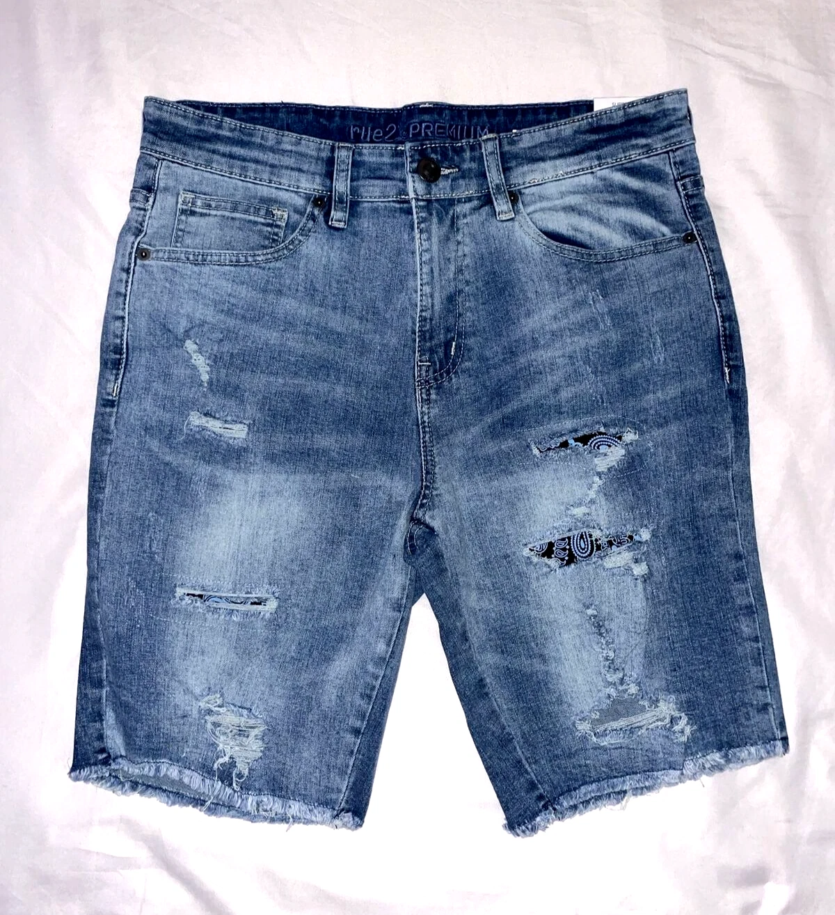 Short en jean bleu vieilli Rue 21 Supreme Flex taille 30 au genou