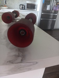 Vintage skateboard wheels and trucks with risers came off of 1970s gas powered