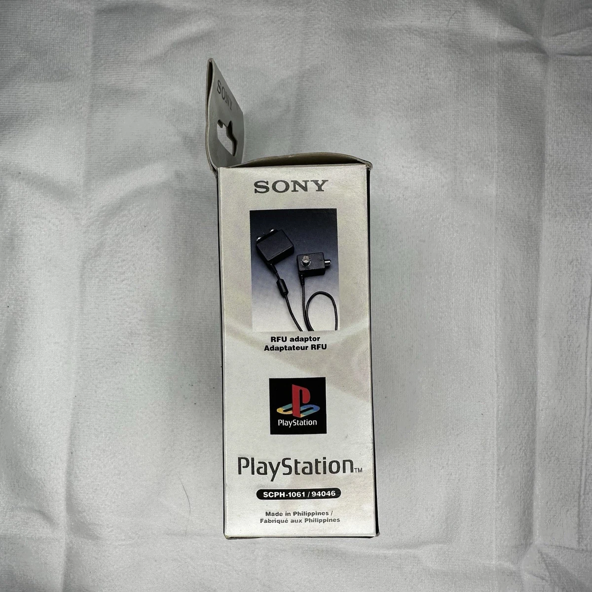 Adaptador RFU OEM Sony PlayStation (SCPH-1061, 94046) con caja y manual, probado