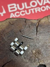 1970s Bulova Accutron JB Champion 2 links to steel bracelet has black center row