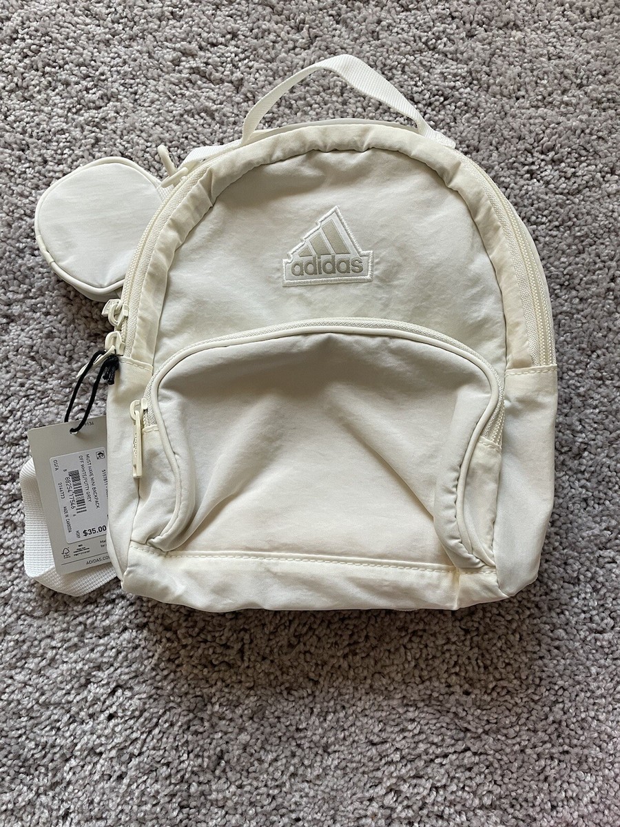 ADIDAS MINI BACKPACK IN OFF WHITE/PUTTY GREY WITH BAG CHARM. ONE SIZE