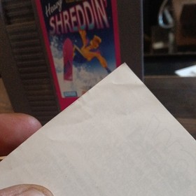 Nintendo NES Heavy Shreddin' game cartridge with manual