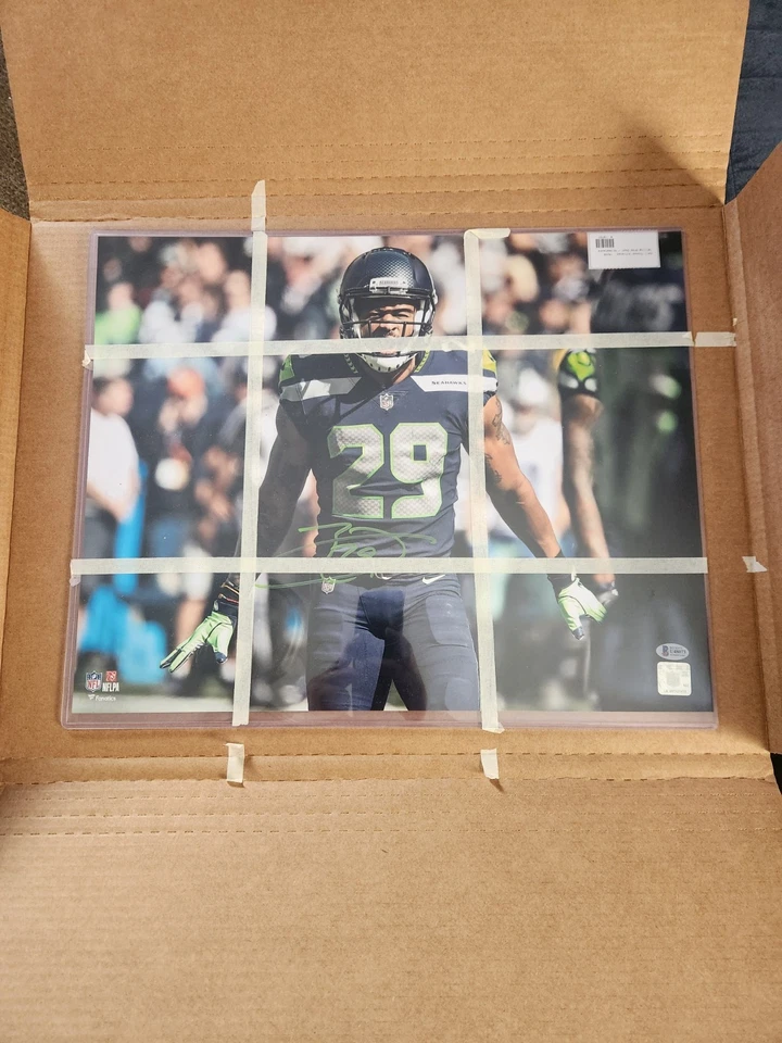 Foto firmada por Earl Thomas de los Seattle Seahawks sin marco 16x20 de la NFL certificada por Beckett Foto 3 de 4