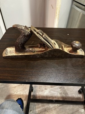 This vintage tool appears to be a Stanley No. 5 Bailey hand plane, commonly