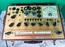 Hickok 800 Vacuum Tube /Transistor Tester, 9 pin base extender, and data books.