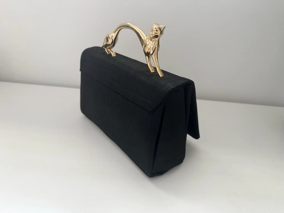 Bolso de mano negro elegante con asa de pantera dorada Foto 3 de 4