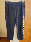 Womens Under Armour size L black straight leg sweatpants logo side stripe pocket — photo 1