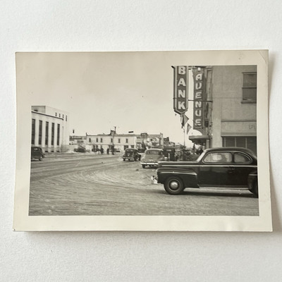 Vintage B&W Snapshot Photograph Car Road Town Buildings Street View