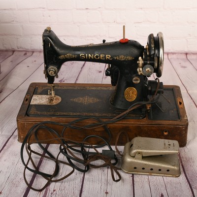value of old singer sewing machine in wood case