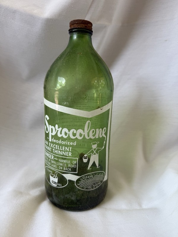 vintage green glass bottle labeled Sprocolenea brand deodorized paint thinner
