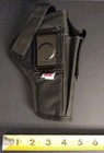 Black nylon IWB holster with red and white stitching, double pistol pockets, and visible white magazine holder.