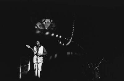 Albert King with a poster featuring the Peter Max 1971 Old Music Photo 2