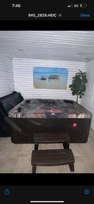 Four Seasons 4 person Jacuzzi Hot Tub with foot massager.  Always  inside.