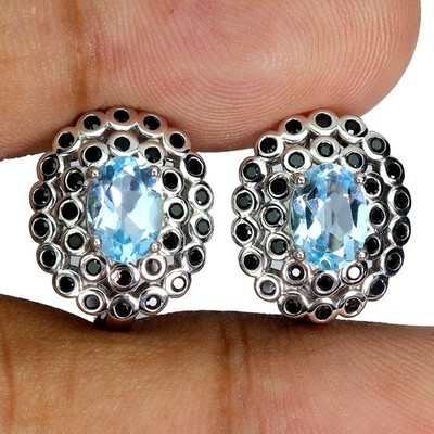 Gemsporium Ohrringe 925 Sterling Silber Oval Sky Blue Topas Spinell 7x5 mm