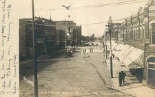 Real Photo Postcard Men Flushing Water Street Scene in Trenton, Missouri