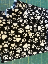 27" White Paw Prints on Black Fleece Fabric OOP