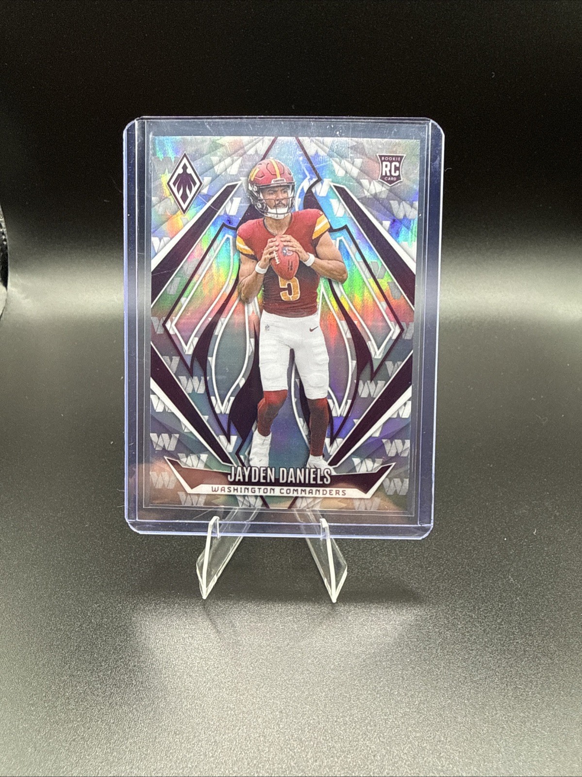 2024 Panini Phoenix - Rookies Jayden Daniels #198 Team Logos /299 (RC)