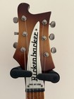 Brown and cream 1981 Rickenbacker 480 with white inlay, silver hardware, and “Made in U.S.A.” text on head.