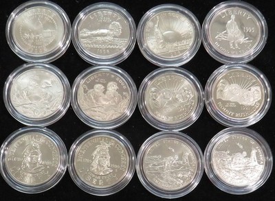 (12) 50c COMMEMORATIVE BU / PROOF CLAD COINS IN CAPSULES