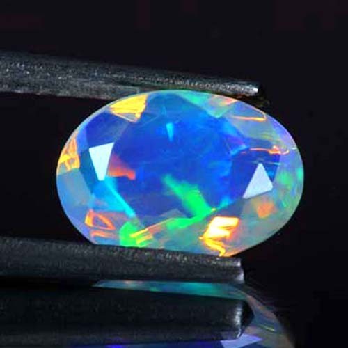 NATÜRLICHER AAA+ VVS UNGLAUBLICHES FARBSPIEL OVAL FACETTIERTER ÄTHIOPISCHER WELO-OPAL 1,10 KT - Bild 1 von 3