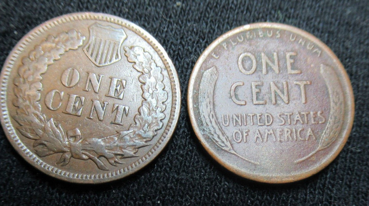 INDIAN HEAD CENT showing on end of old black unsearched us wheat penny