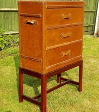 Three  Drawer Faux Leather Chest On Mahogany Stand