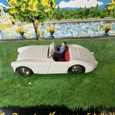Five Dinky Toys cars, comprising a No. 112 Austin Healey Sprite, a No. 113 M.G.B. Sports Car, a No