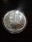 1986 American Silver Eagle in Capsule- BU - A Tad of Toning Starting - FREE Ship