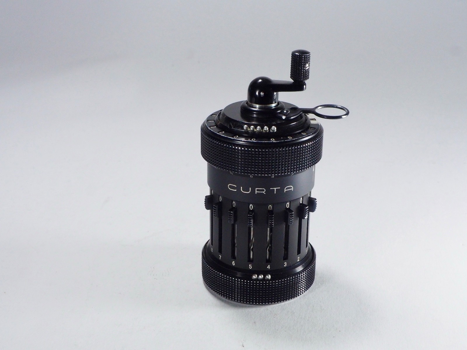 Curta Calculator 1954 Type 1 all metal w/can, box, 3 manuals, perfect function