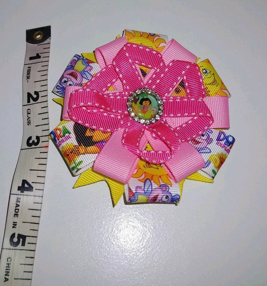 NICKELODEON Dora la Exploradora Rosa Blanco Amarillo Niñas Pelo Moño Clip Accesorio Foto 2 de 3