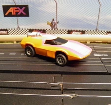 AFX  used #1755 Orange & Purple Turbo Turn On Magna-Traction. Runs GREAT.