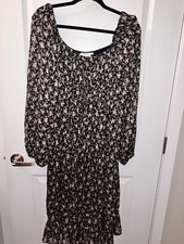 black midi dress with floral pattern and shimmery accents 