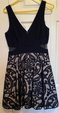 Deep Sleeveless V-Neck Cocktail Dress with Mesh Cutouts & Flounce Detail,Size 12