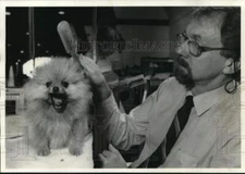 1988 Press Photo Jerome Cushman with Pomeranian Puppy, Mr. Sandman, New York