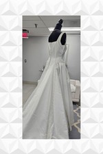 B8904 is a white satin gown with a square neckline