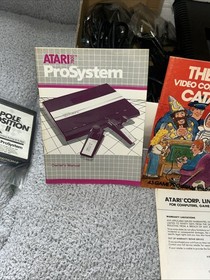 Atari 7800 Video Game complete with (Game, manual, controllers and inserts).