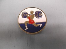 lot of 9 male weightlifter trophy parts 2" diameter blue white red insert