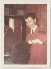 Smiling Barber at Work Capturing the Craft of Classic Hairdressing in Style Phot