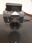 Aparat filmowy Zenit-E vintage ze skórzanym etui i osłoną obiektywu - częściowo przetestowany 
