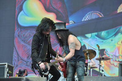 Guitarist Slash performs with Bassist Todd Kerns live on stage at  - Old Photo 1