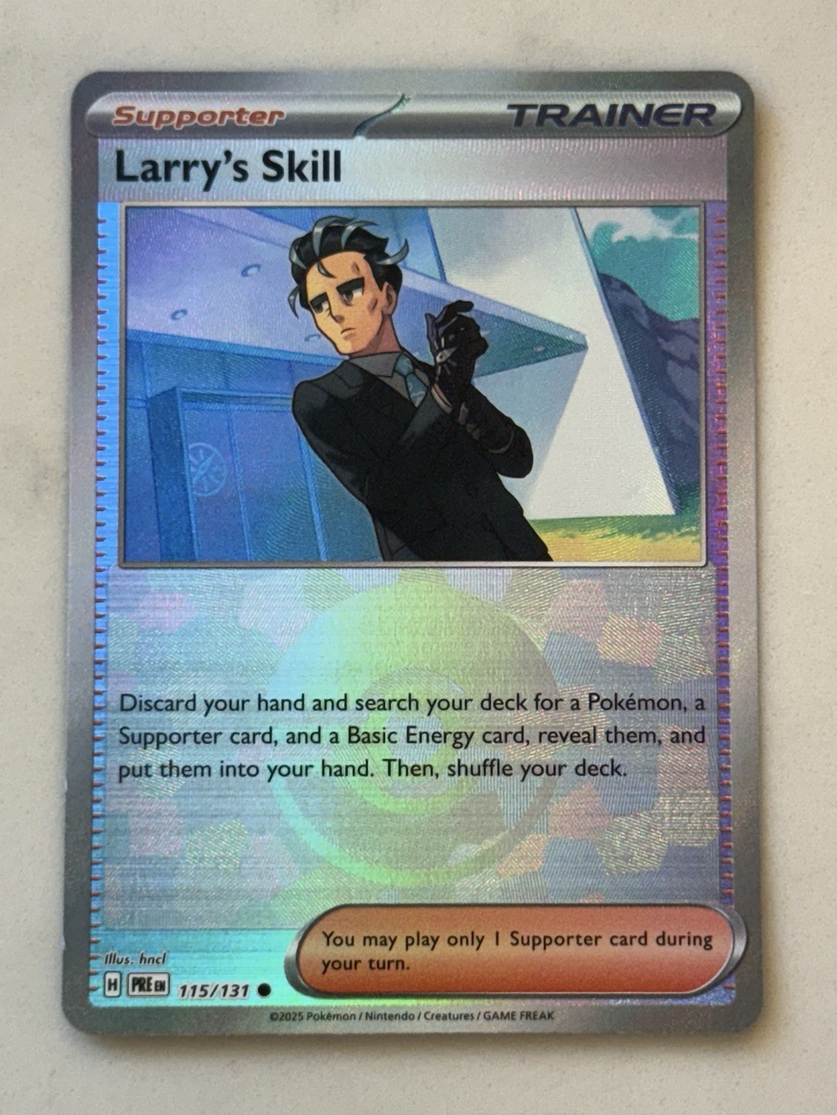 Larry's Skill 115/131 Pokemon Prismatic Evolutions Poke Ball Holo - NM/Mint