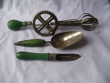 Three Piece Green Handled Utensils Hand Mixer, Measuring Scoop And Apple Peeler