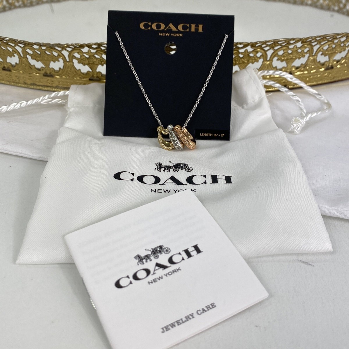 COACH キッシングCロンデルネックレス New Coach Rondel Pendant Necklace Tricolor Triple Signature