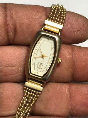 Ladies Gold Tone Joel 93-95MK Analog Watch