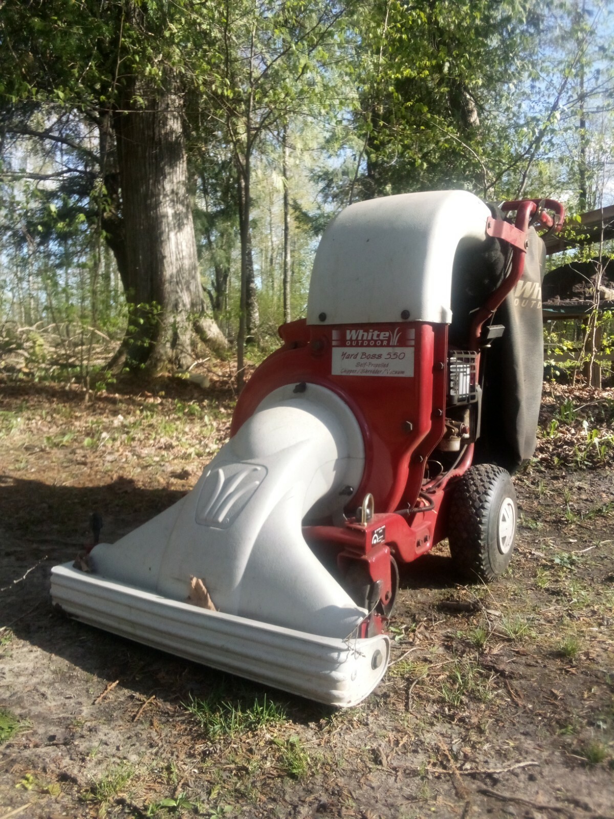Self Propelled lawn vacuum, shredder, and Grelly USA