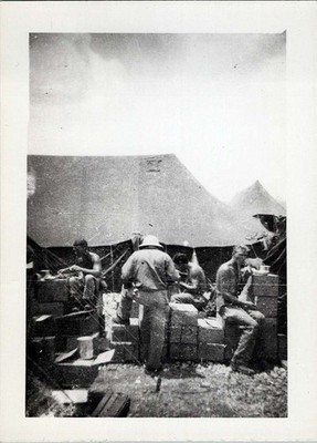 1946 Photo of Soldiers Working at Tent Camp Opening Supply Crates