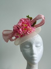 New white saucer fascinator with pink silk abaca loops and flowers on a headband
