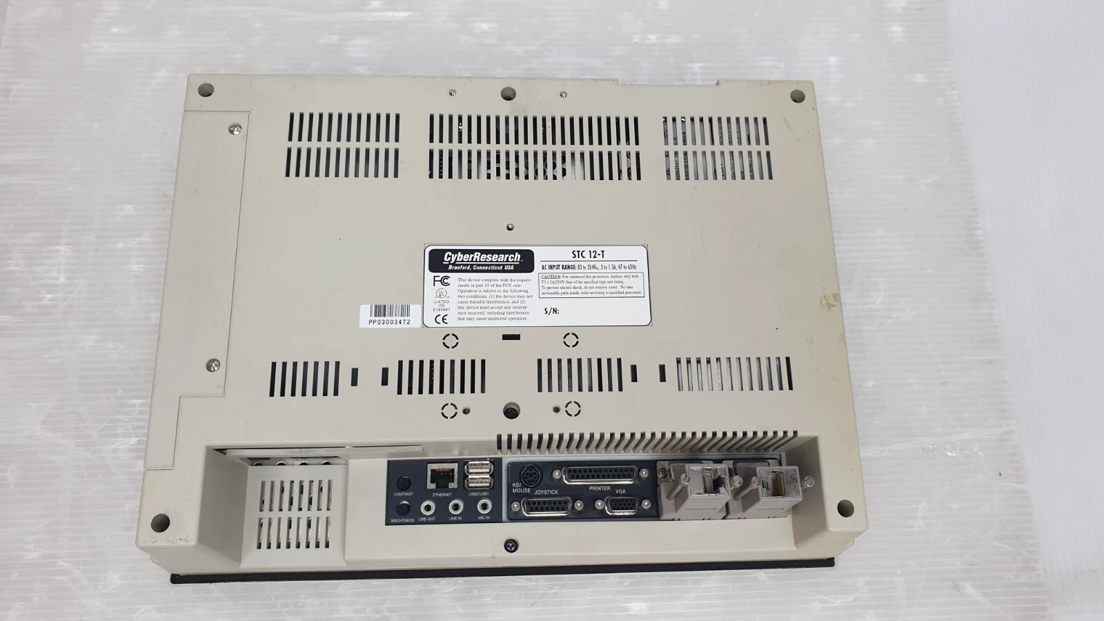 Rear of the CyberResearch STC 12-T with nameplate and two serial-port adapters fitted