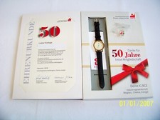 Ehrengeschenk mit Armbanduhr, Urkunde,  Ansteckpin für 50 Jahre Mitglied IG BCE