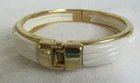 VINTAGE COSTUME JEWELRY WHITE LUCITE IN GOLD TONE CUFF BRACELET